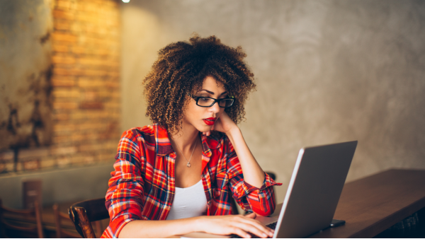 Image of a person working and learning at their computer. This image represents the various education resources that exist for Lichen Sclerosus.