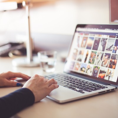 Image of a computer open on a desk. This image represents Denise trying to find answers and support with lichen sclerosus.