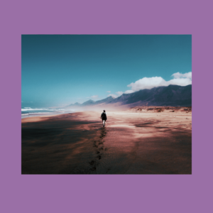 Image of a person walking down a very long beach. This represents my dilator journey. The background is a pale purple.