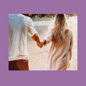 Image of two people holding hands in a field, amongst a pale purple background.