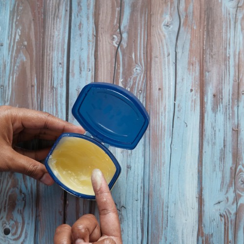 Image of an open jar of Vaseline, which can be helpful to apply before and after urinating.