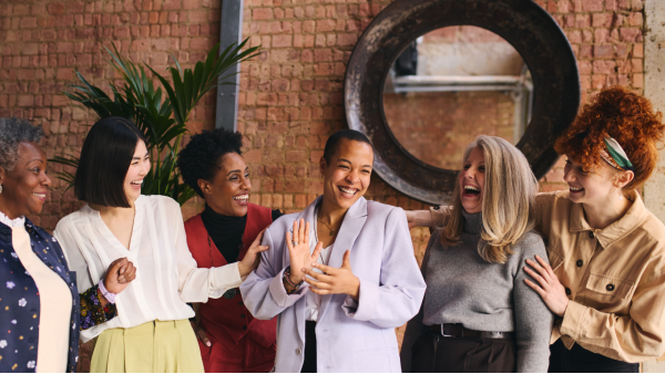 Image of a bunch of people talking and laughing together representing the LS communities.